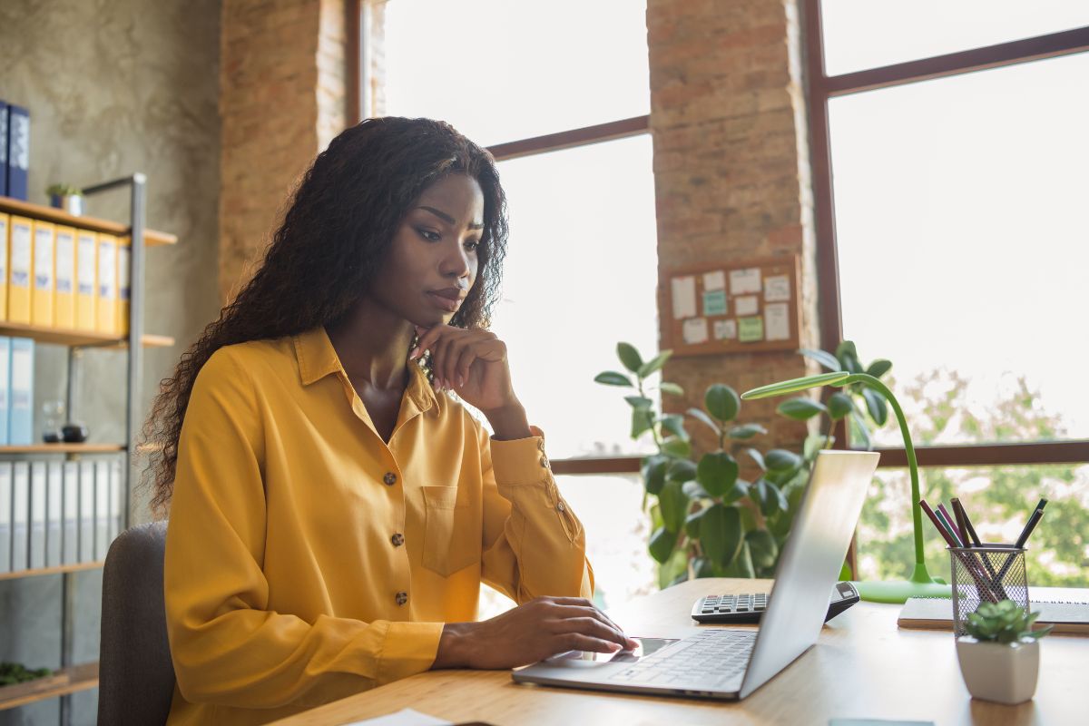 A picture of a lady focusing on her work. 