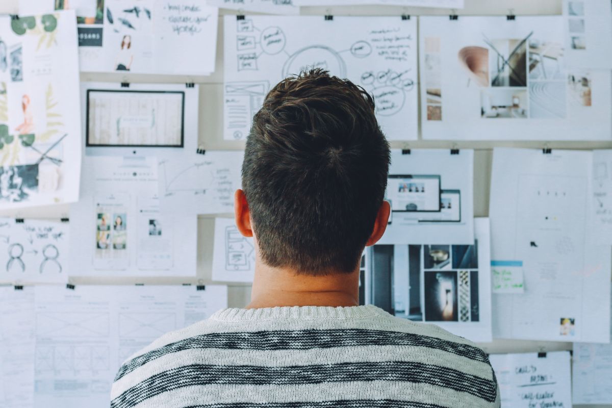 A picture of someone looking at his dream vision board.
