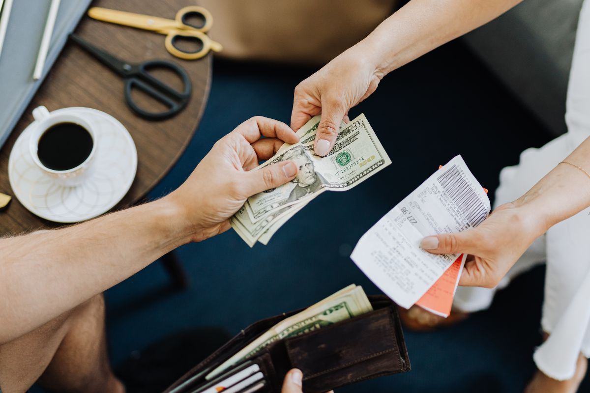 A picture of someone paying debt.