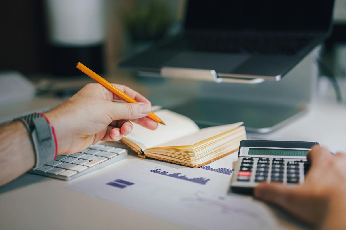 A picture of someone planning their  finances.