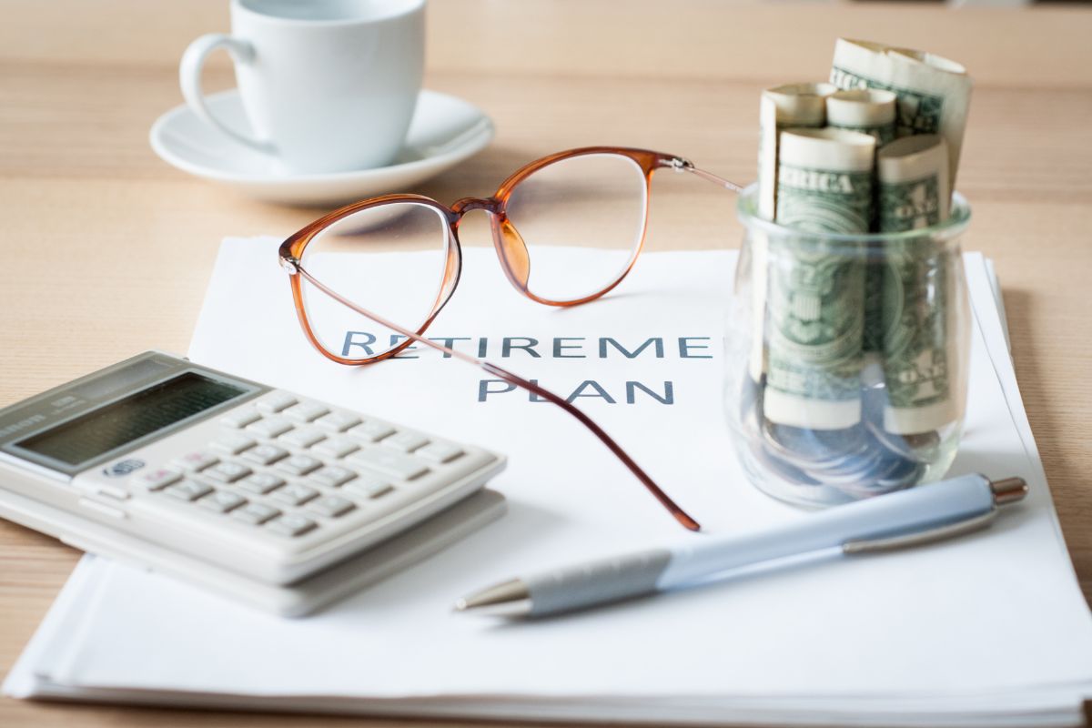 A picture of a retirement plan and money. 