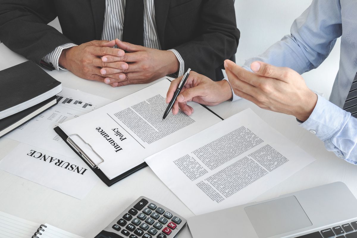 A picture of someone getting an insurance policy. 
