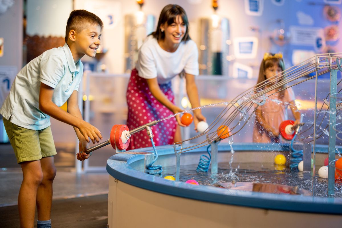 A picture of a family playing at an interactive museum.