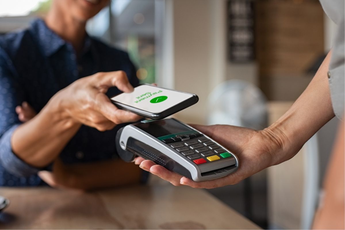 A picture of someone paying through phone. 