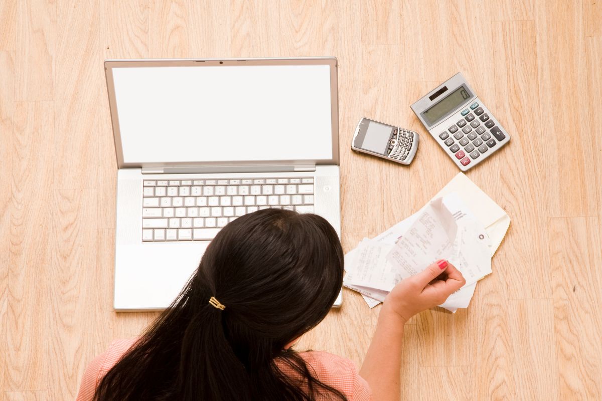 A picture of a lady tracking her expenses. 