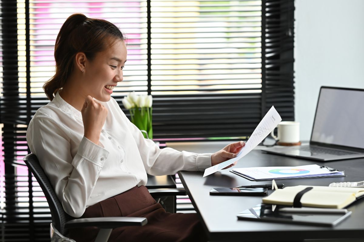 A picture of a lady looking at her financials.