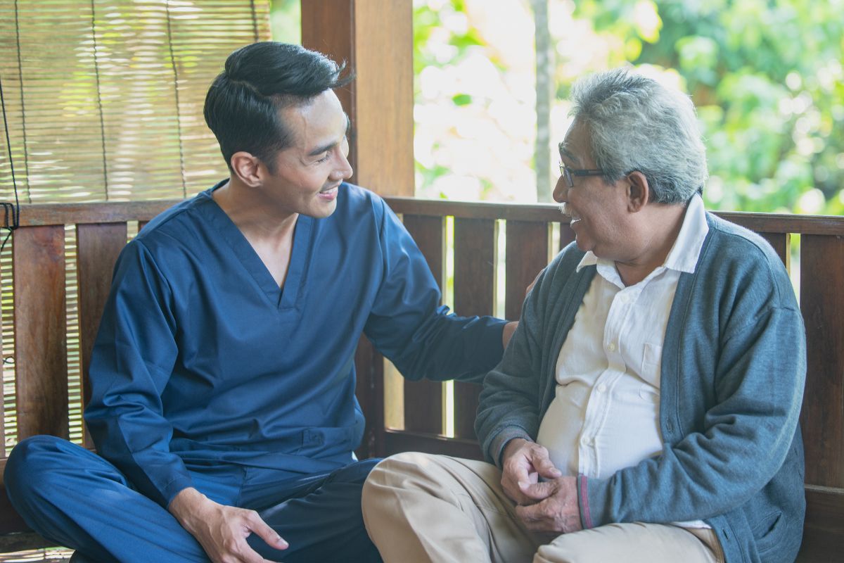 A picture of a nurse with his patient. 