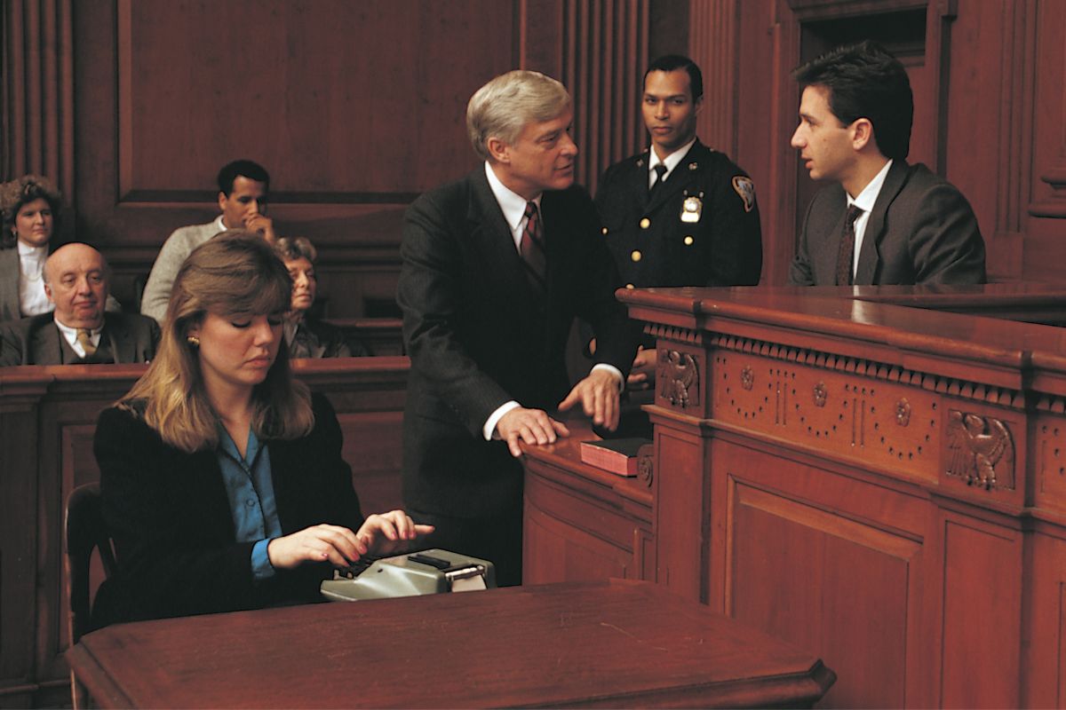 A picture of a court reporter during cross examination. 