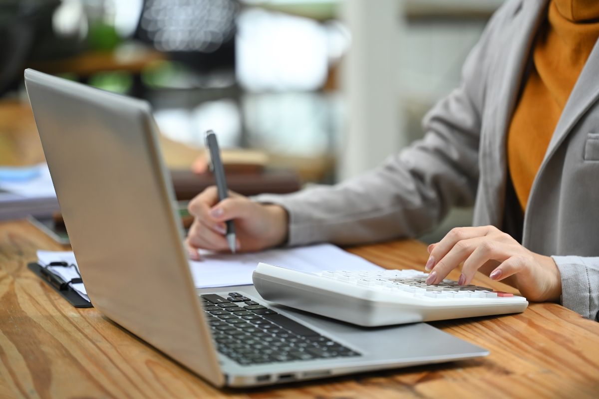 A picture of a Data Entry Specialist calculating something. 