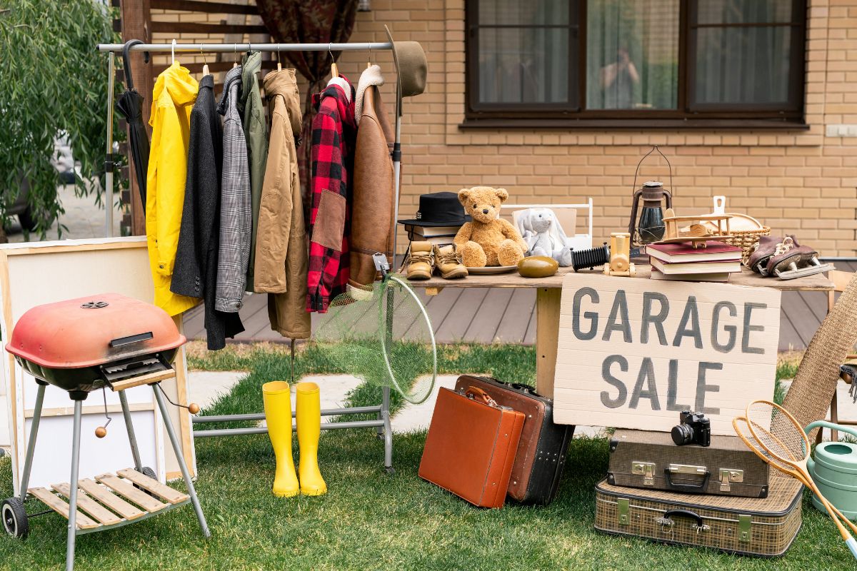 A picture of someone doing a garage sale.