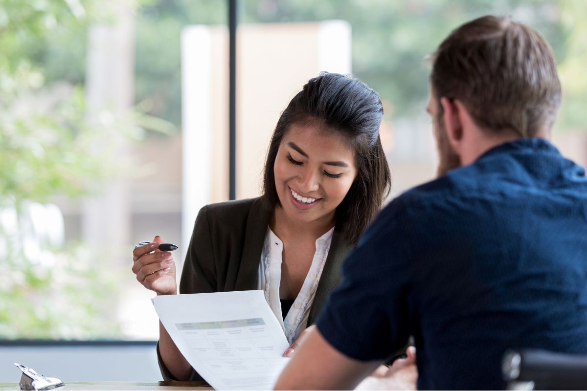 A picture of a Loan Officer with her client.