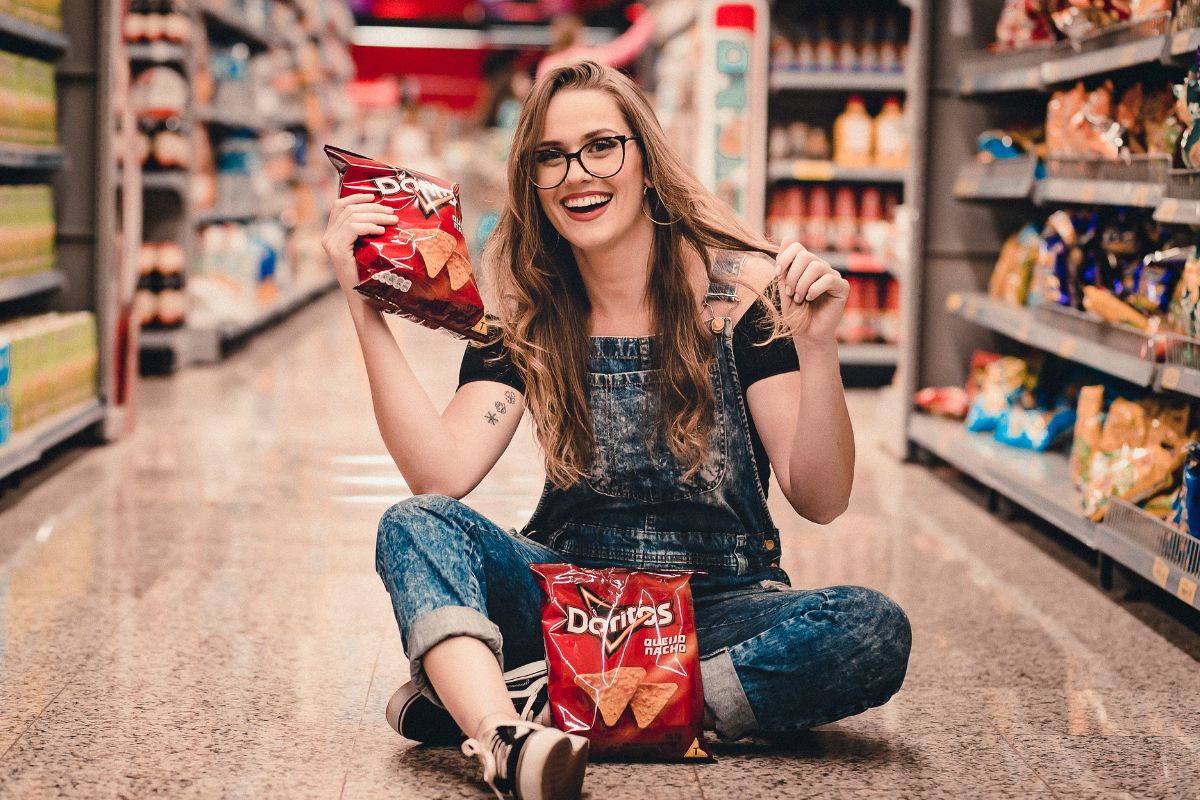 A picture of a lady with chips. 