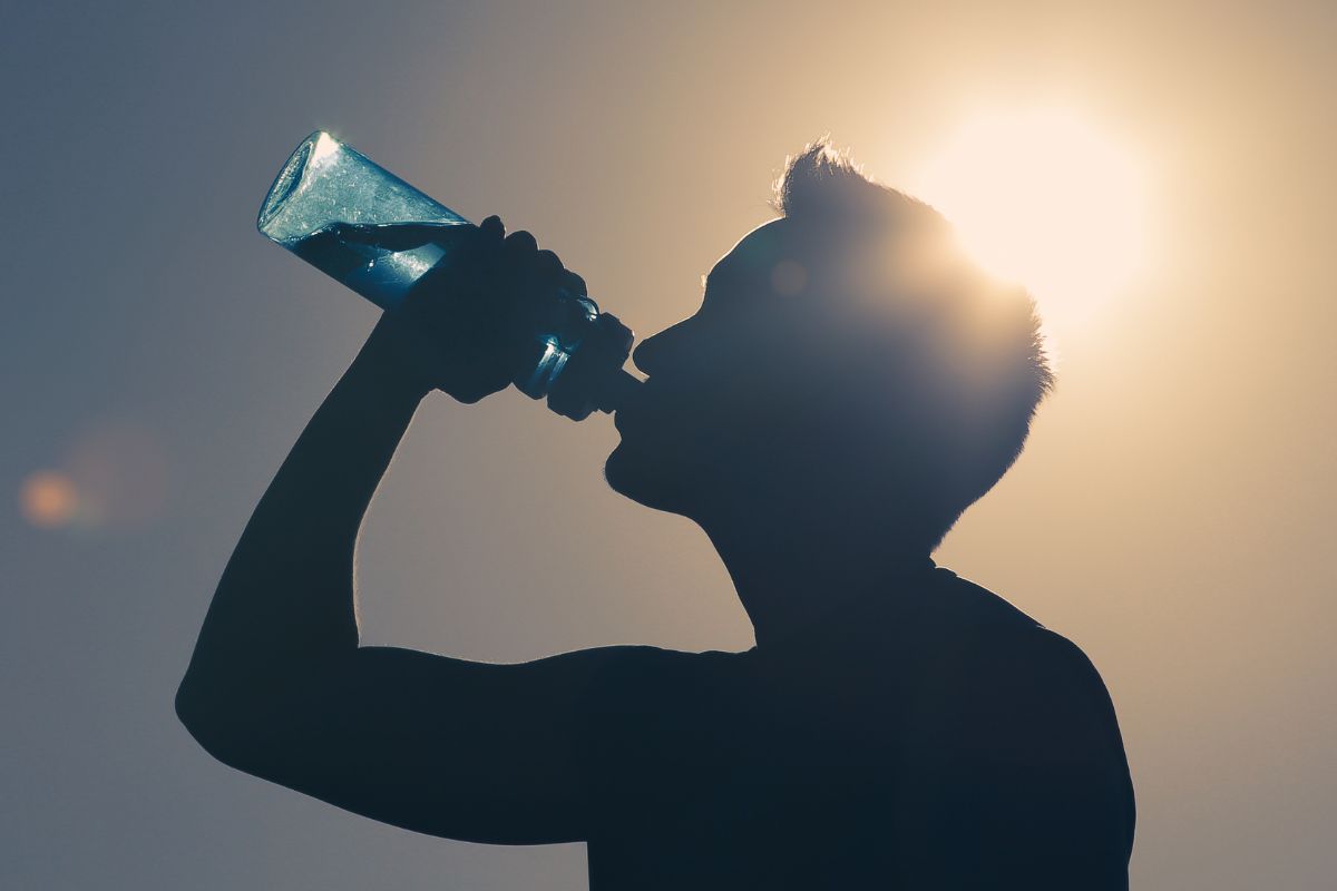 A picture of someone drinking water.