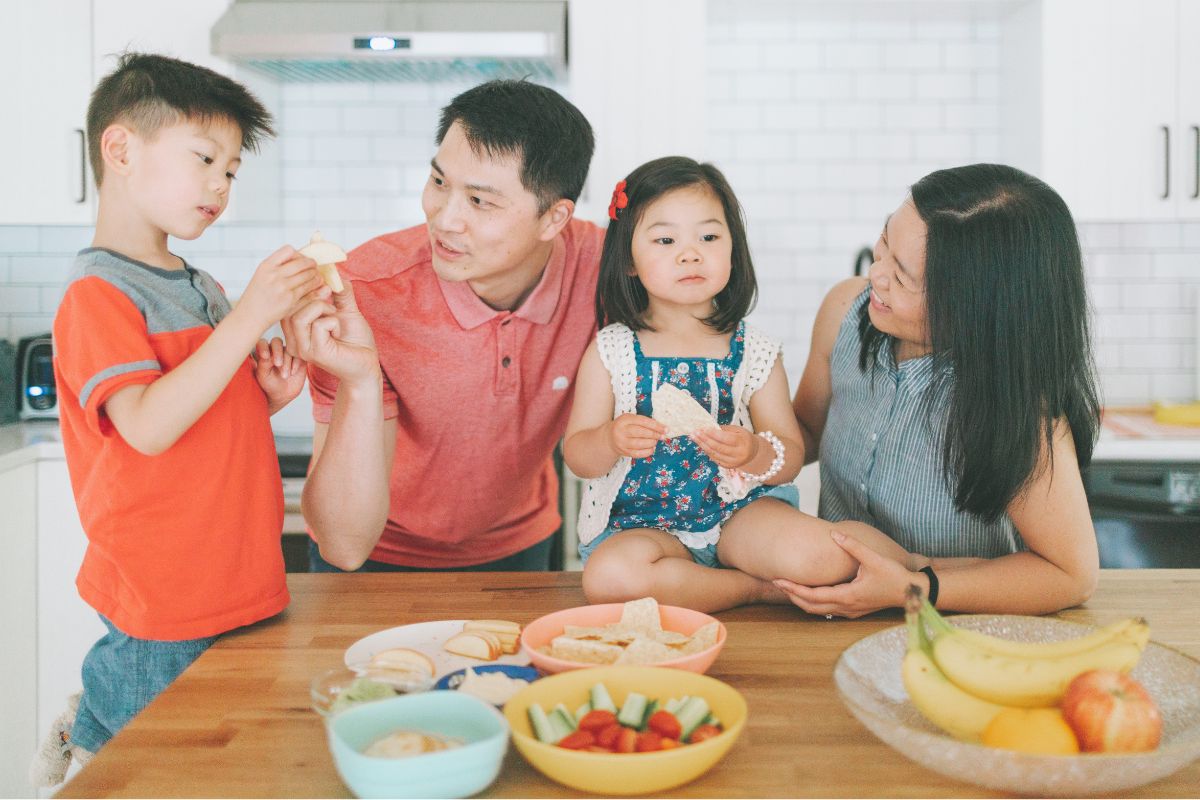 A picture of a family eating foods from their pantry. 