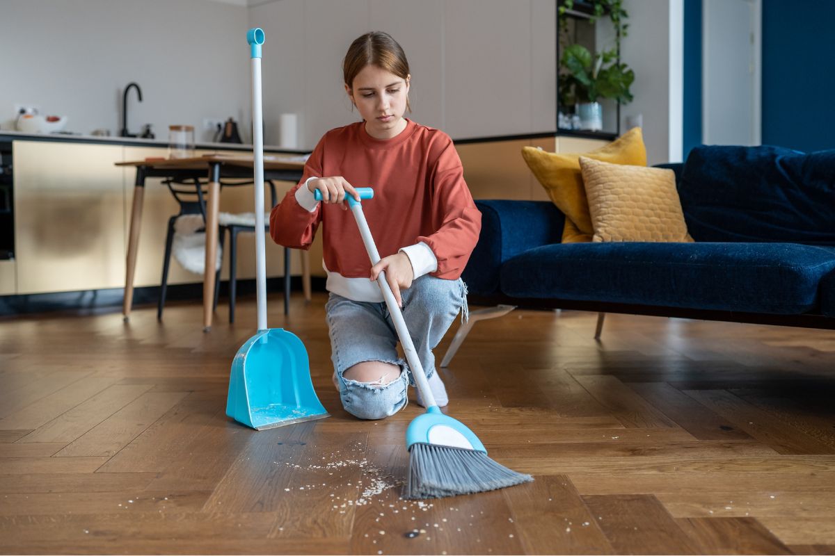 A picture of a lady housekeeping.