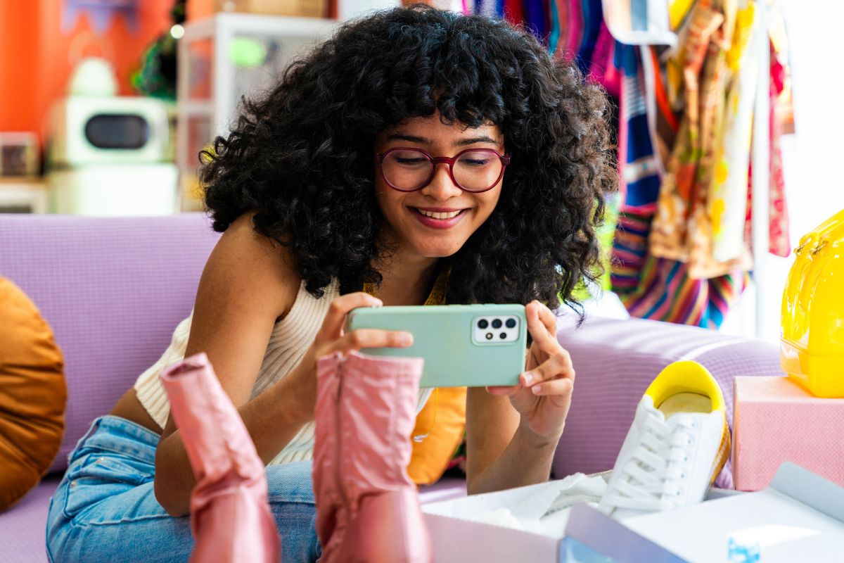 A picture of a teenager selling her shoes online.
