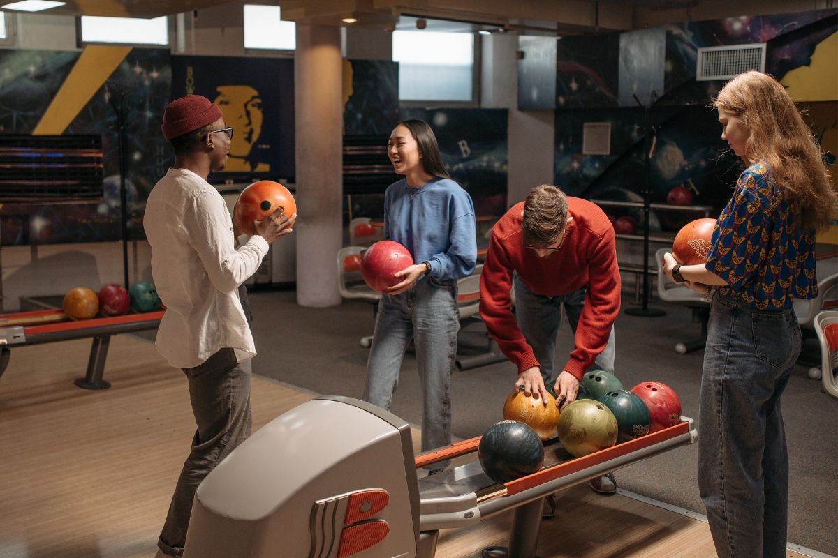 A picture of friends playing bowling. 