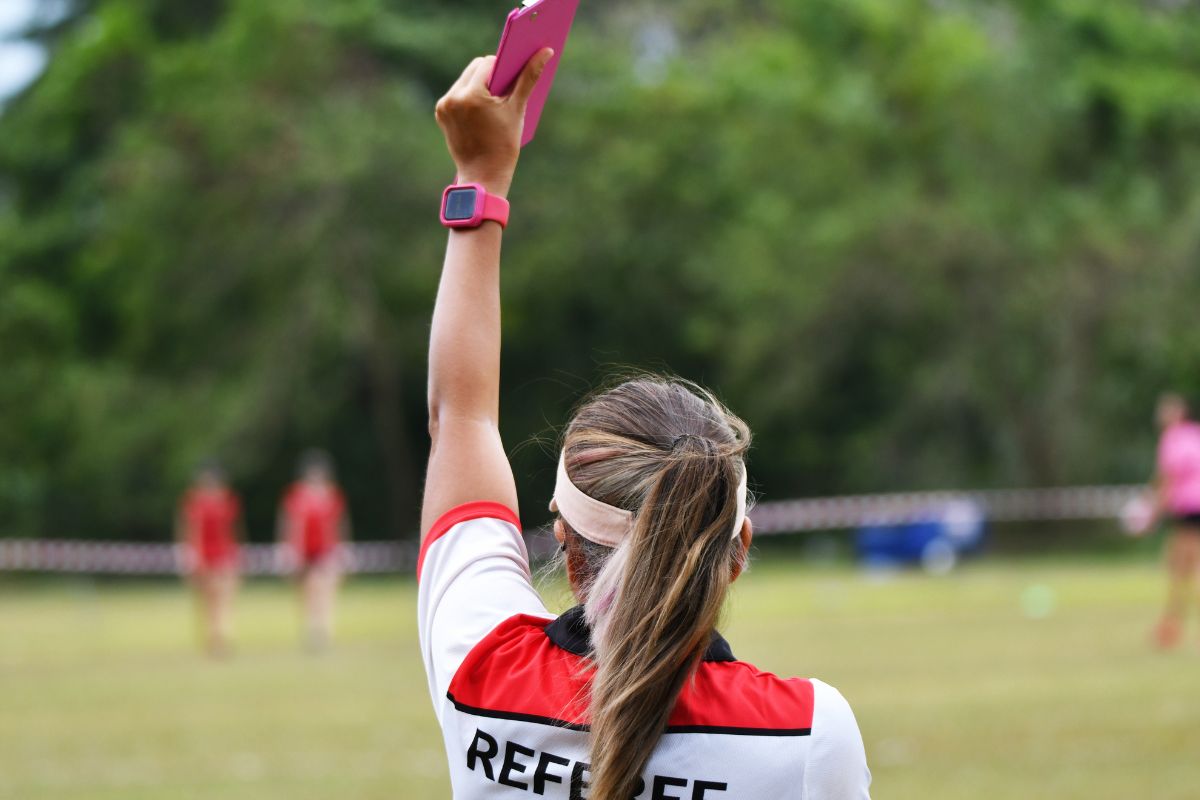 A picture of a lady refereeing.