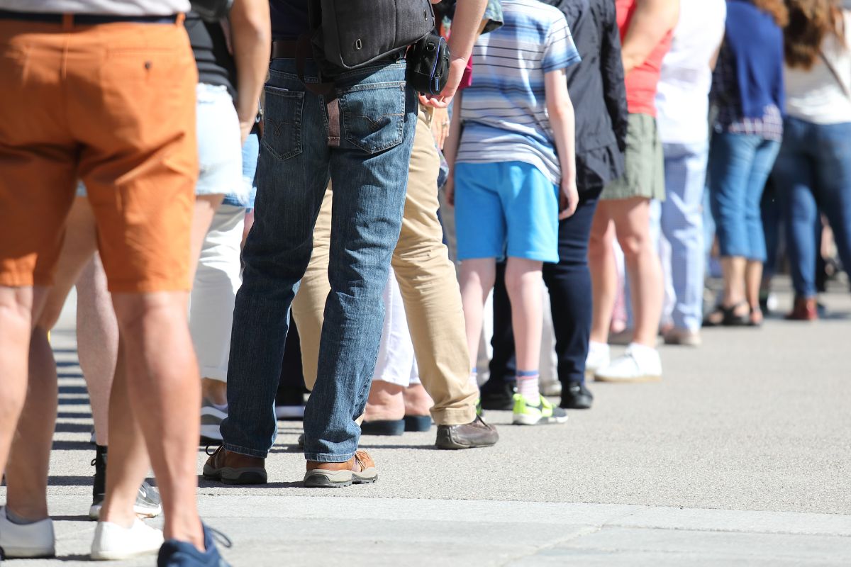 An image of people waiting in line.