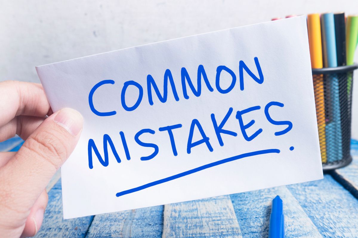 The picture is about a lady's hand holding a piece of paper with common mistakes in wording.