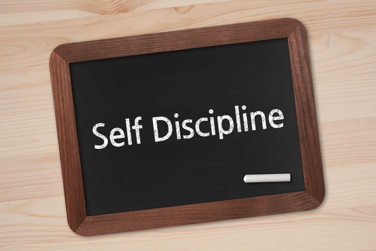 The photo shows a board with self-discipline wording.