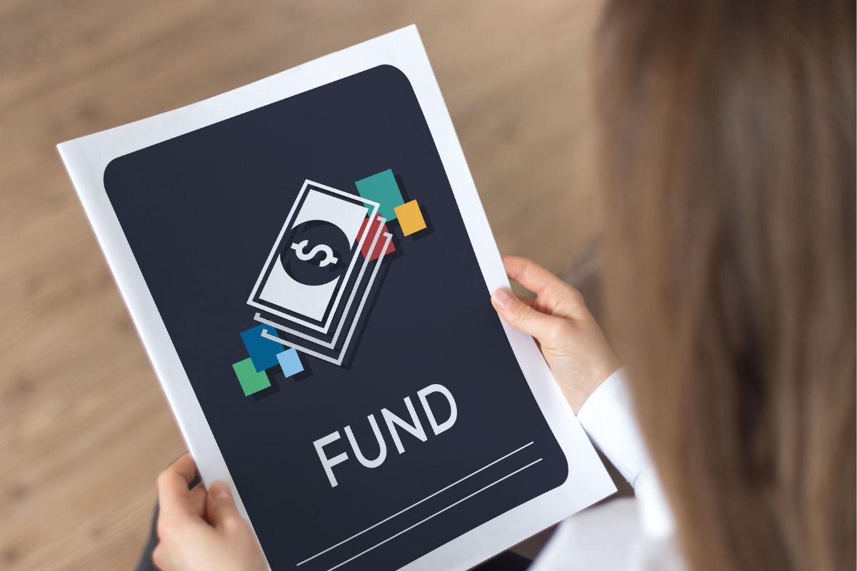 The picture shows a young lady holding a book with a fund title.