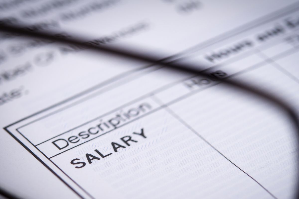 The picture is about a paper with a salary description.