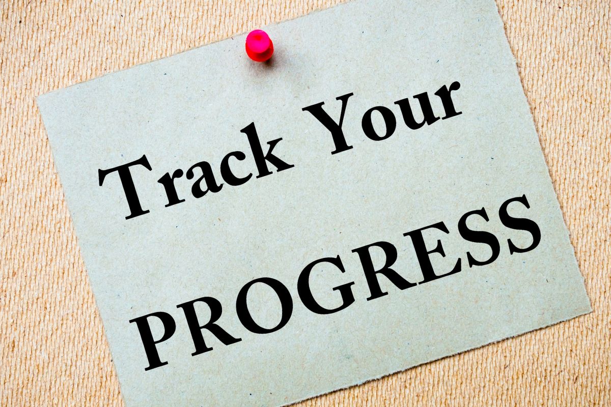The photo shows a paper with the Track Your Progress wording.