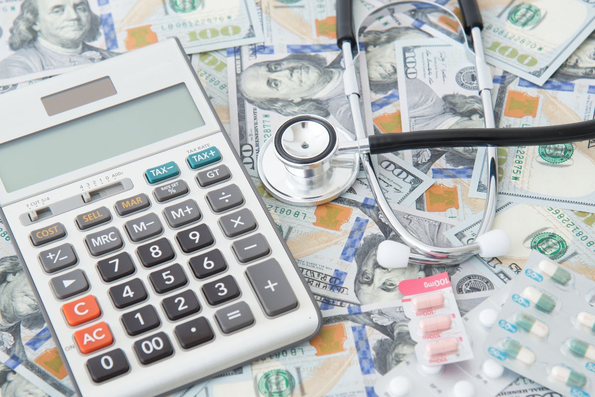 The image is about dollar bills and medical tools for healthcare expenses.