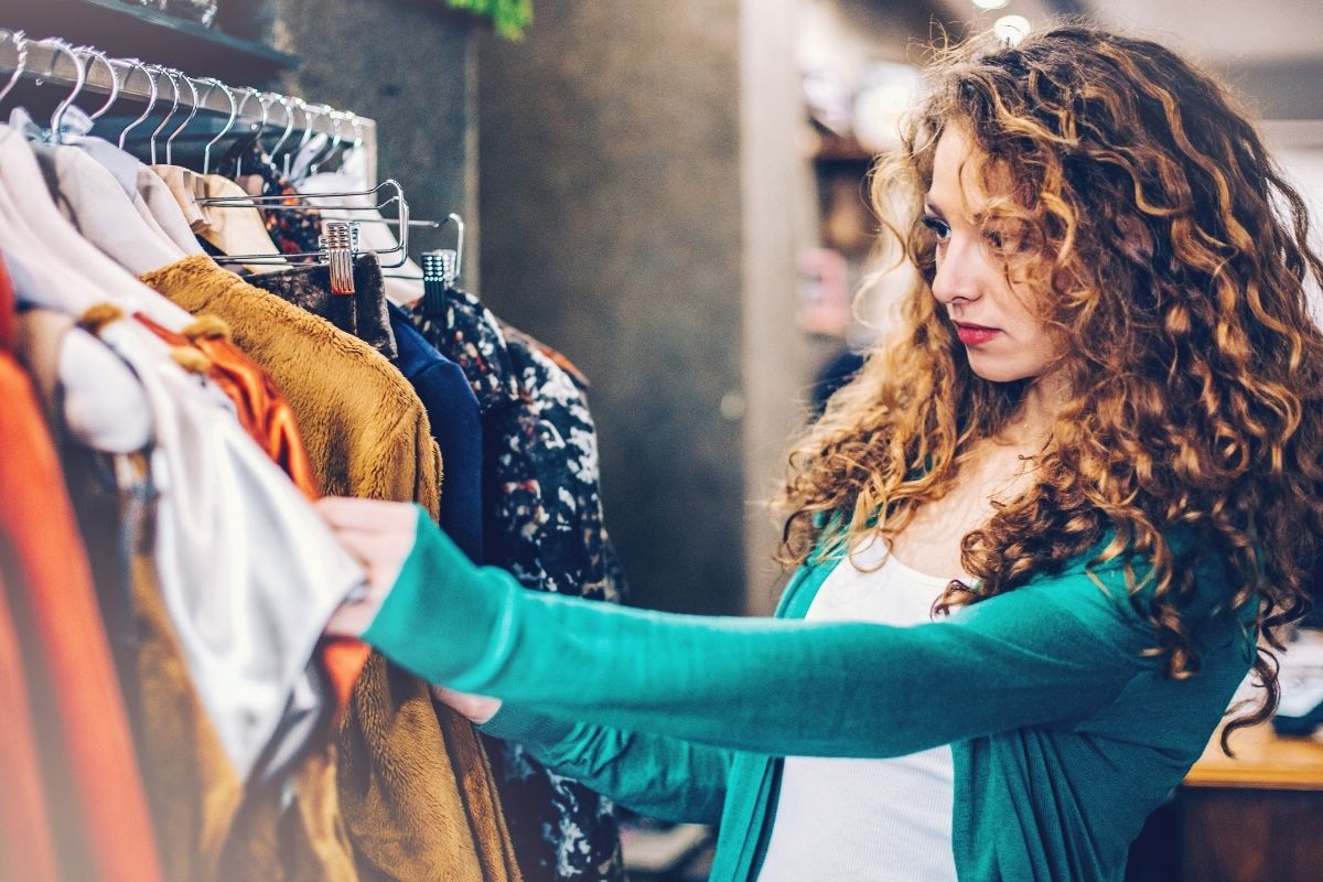 The image shows a young lady shopping for emotional comfort.