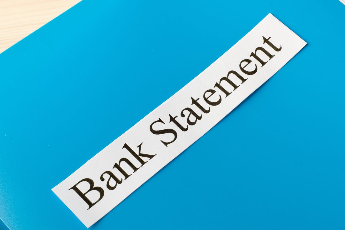 The picture shows a file with bank statement notes.