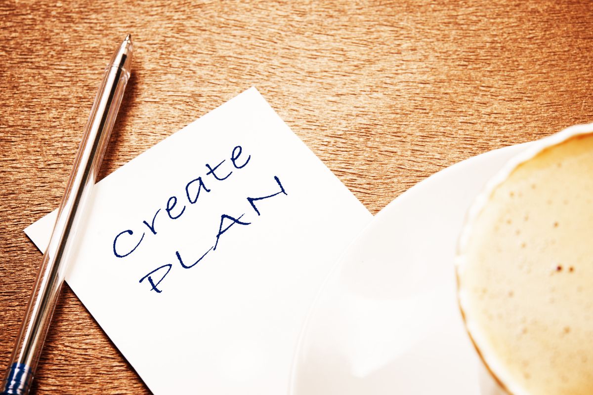 The image is about a pen and paper with a create plan wording.