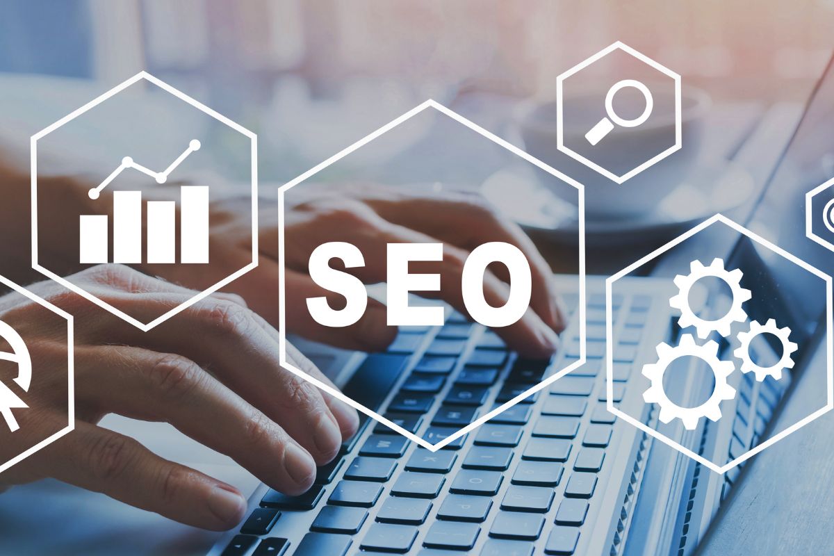 The photo of a man's hand using a laptop while working for SEO.