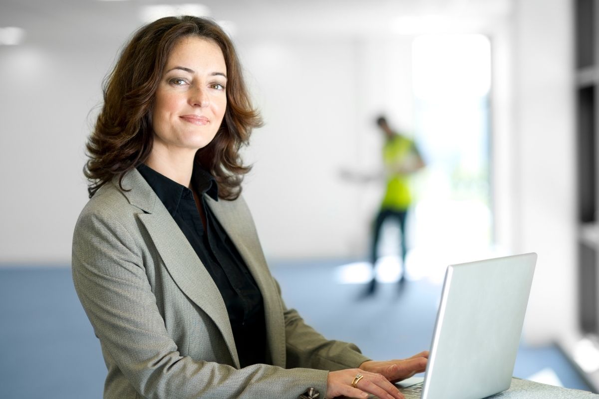 The image shows a girl using a laptop for business development work.