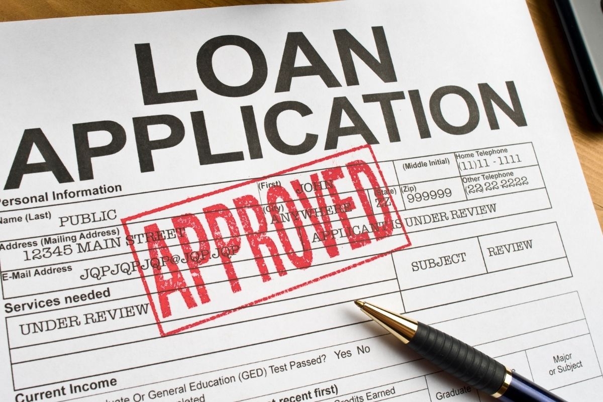 The image shows a loan application being approved.
