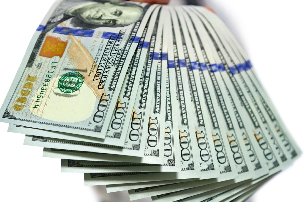 The image is showing off money referring to hopes to win money vs building wealth