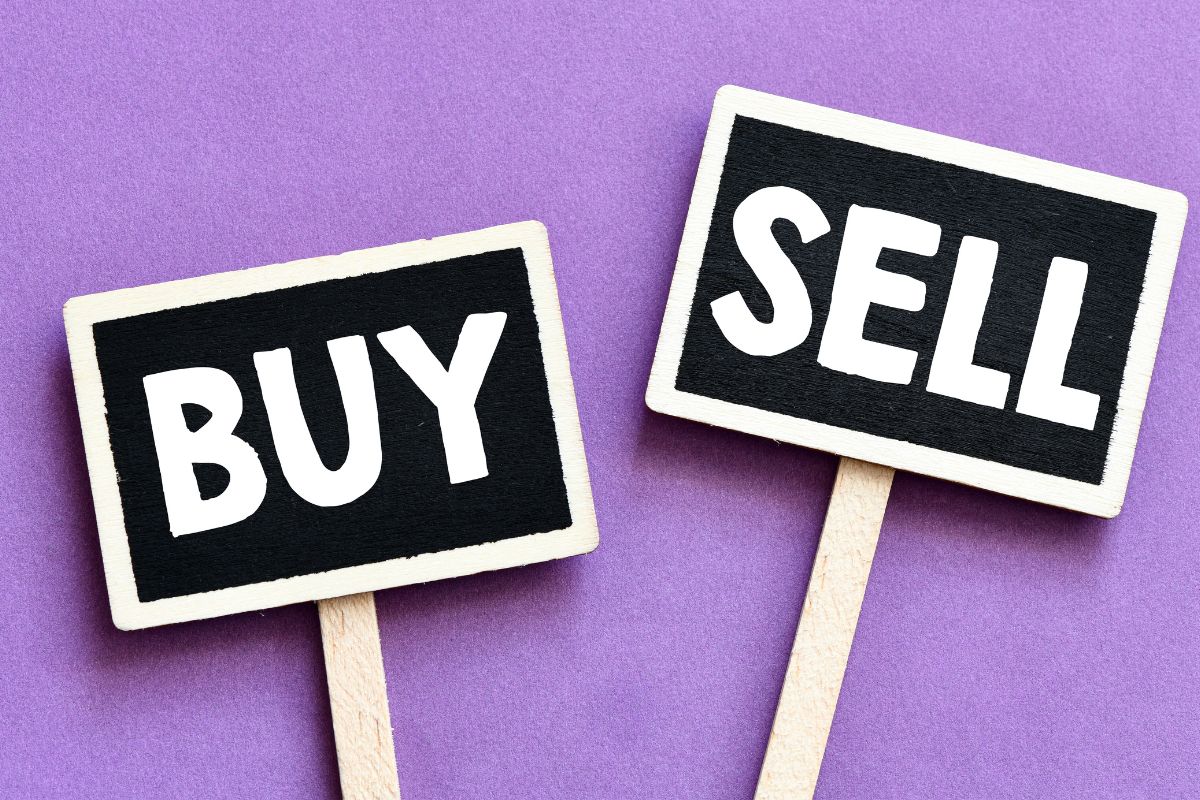 The image shows two boards with buy and sell words.