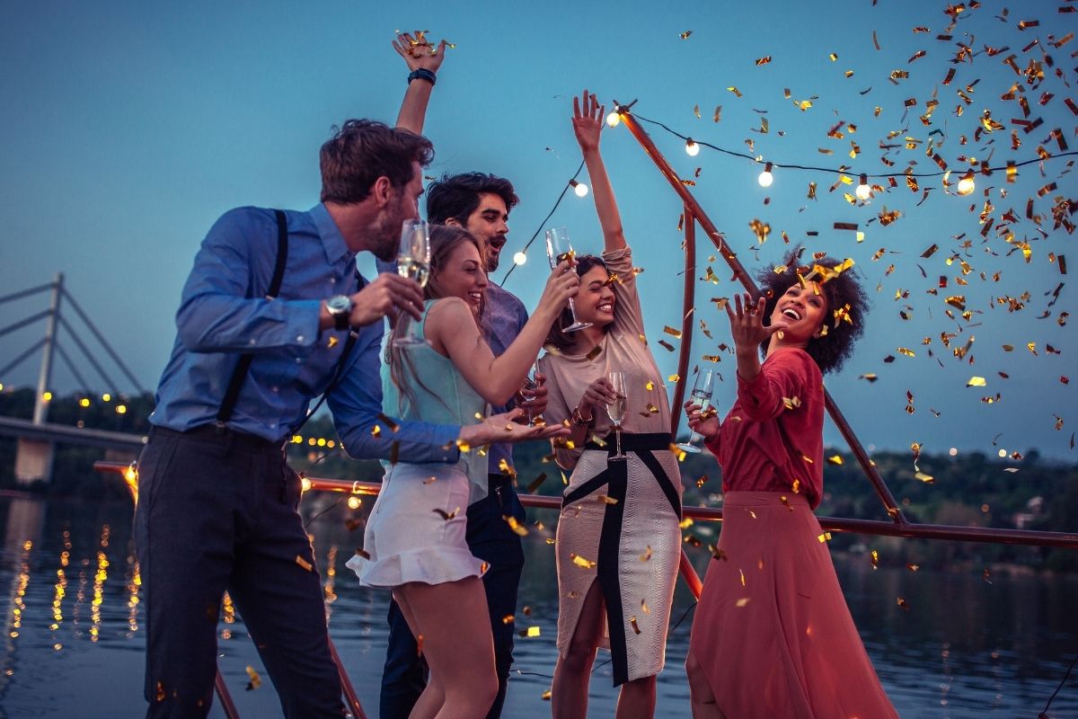 The picture shows a group of people enjoying at the seaside.