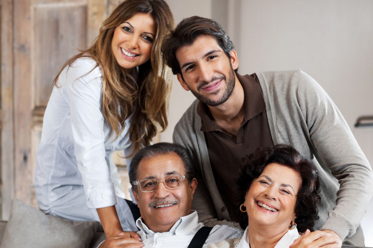 The picture shows parents together with their adult children.