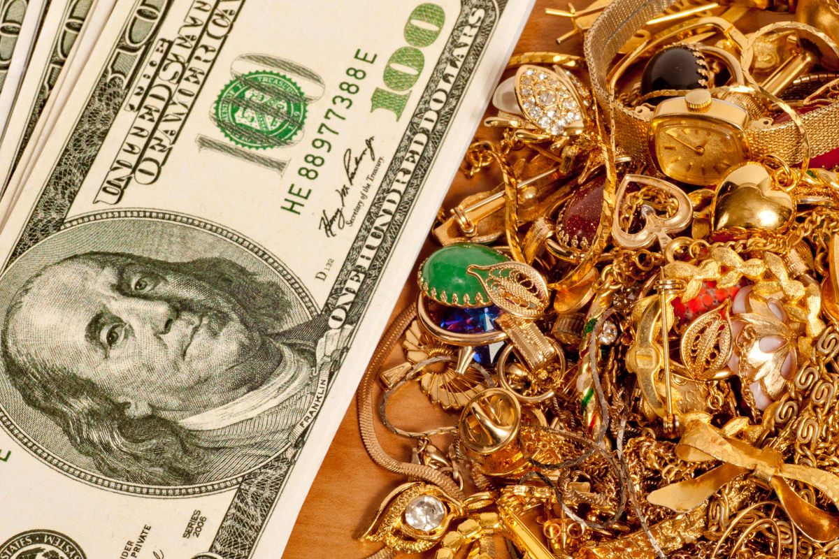 Image of dollar bills and jewelry golds.