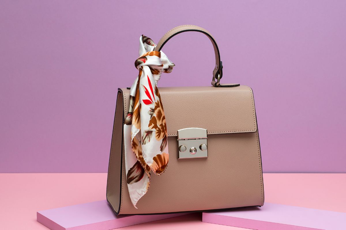 The photo shows a luxury bag display.