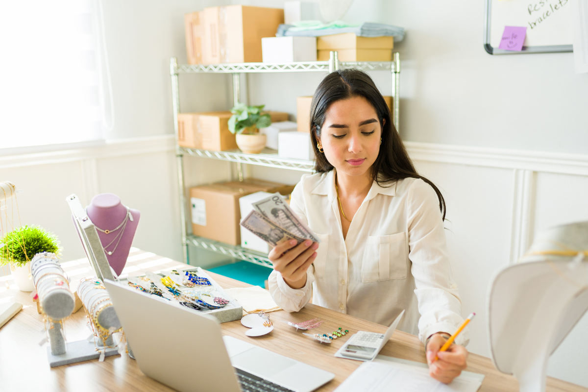 The photo of a lady doing inventory of her online products.