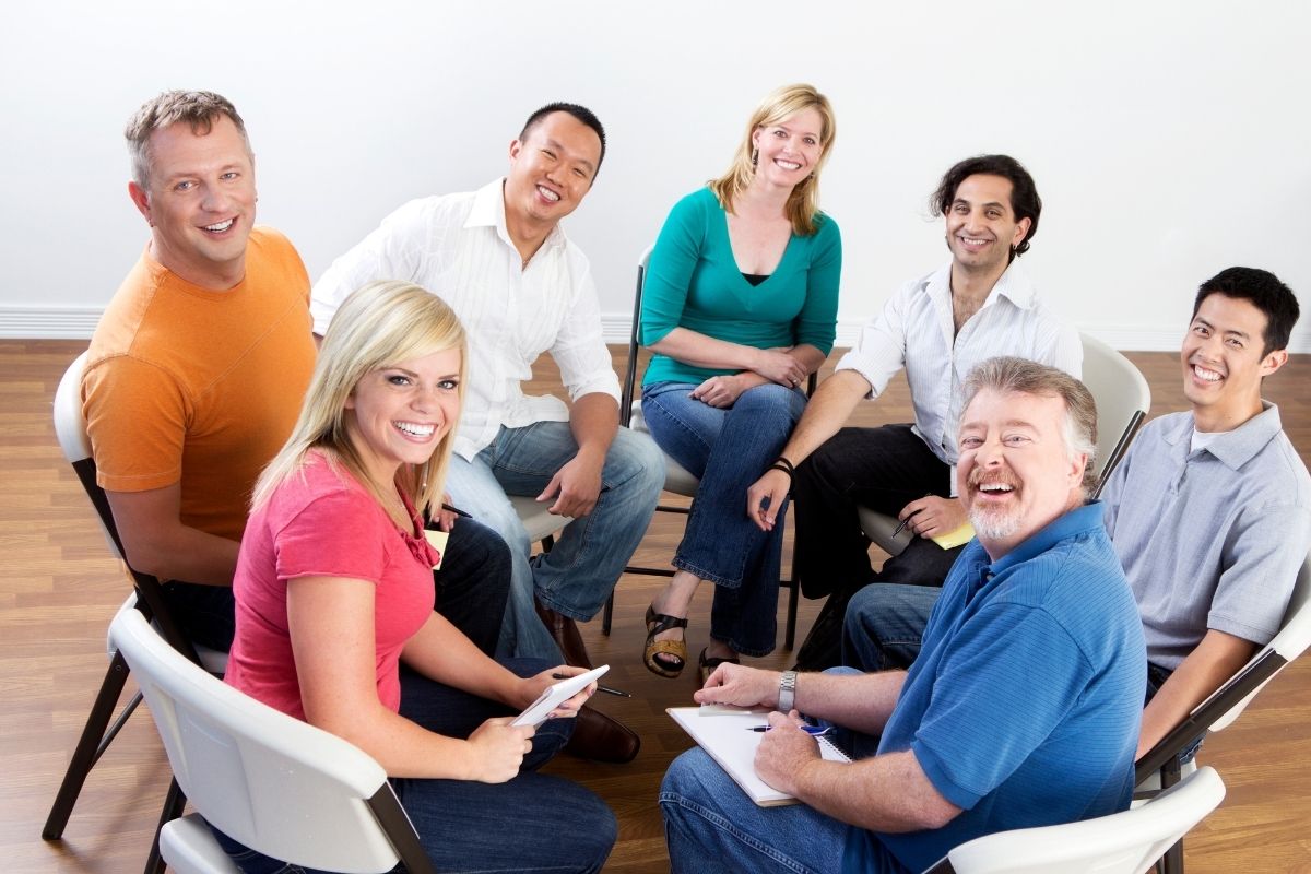 The photo shows a group of people having a session together.