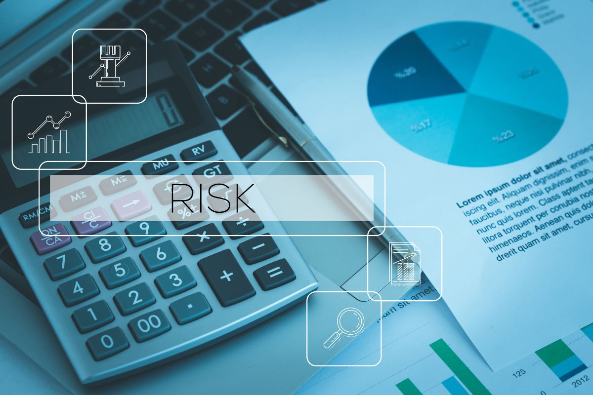 The photo of papers, a laptop, a calculator, and screen risk text and icons.