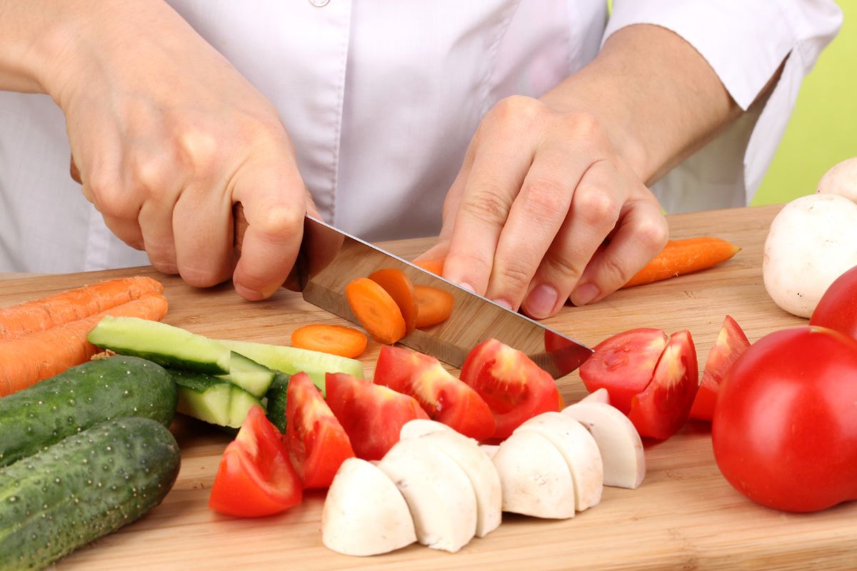The photo shows a lady shopping for the ingredients for multiple meals.