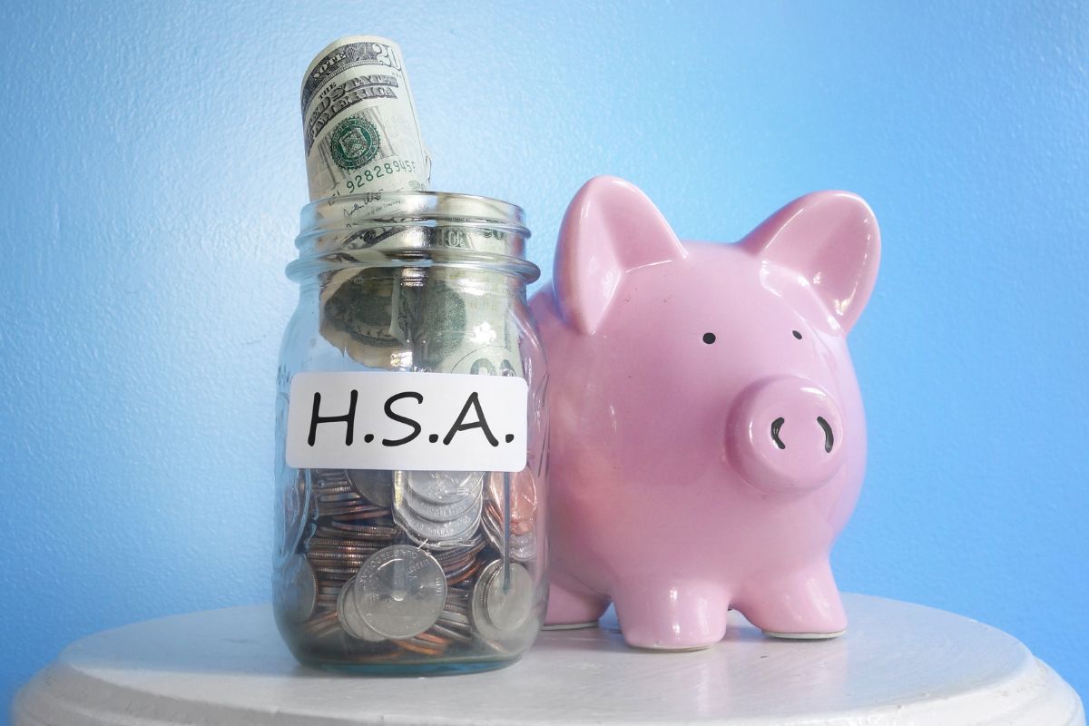 A picture of a jar full of money for a health savings account.