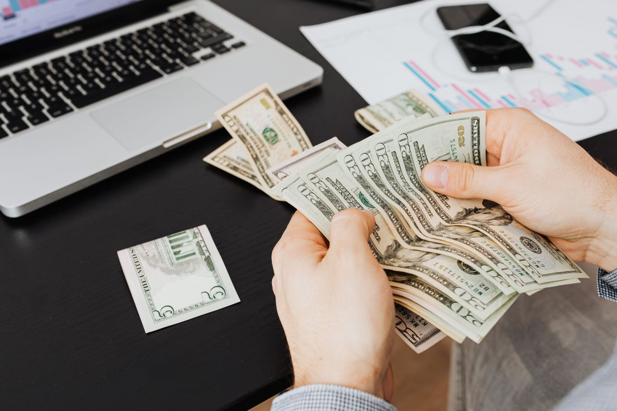 A picture of someone counting money. 