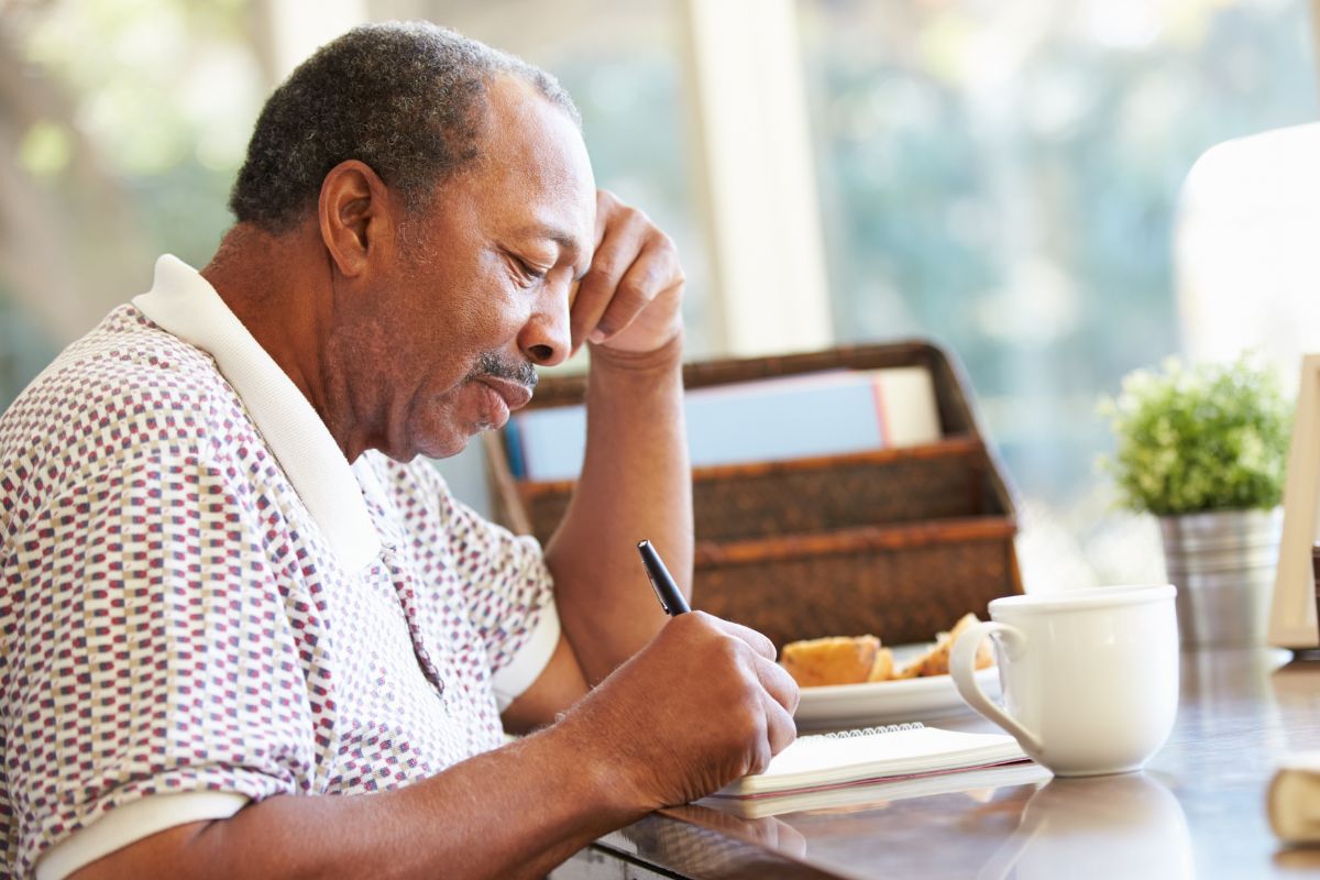 A picture of someone writing. 