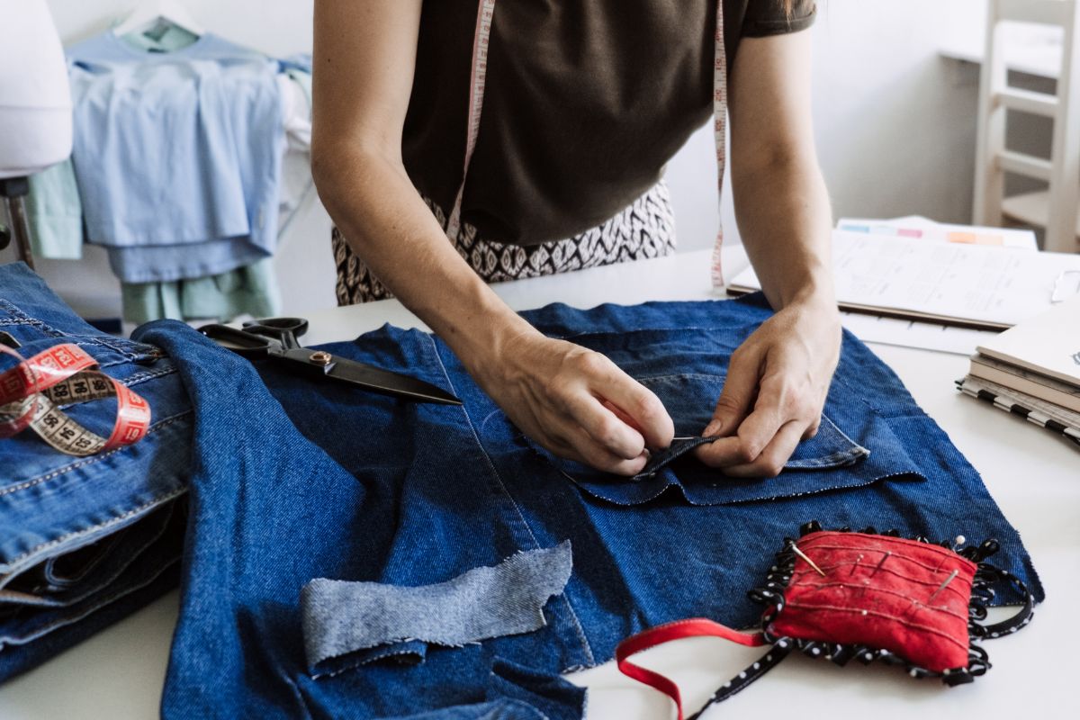 A picture of someone mending clothes. 