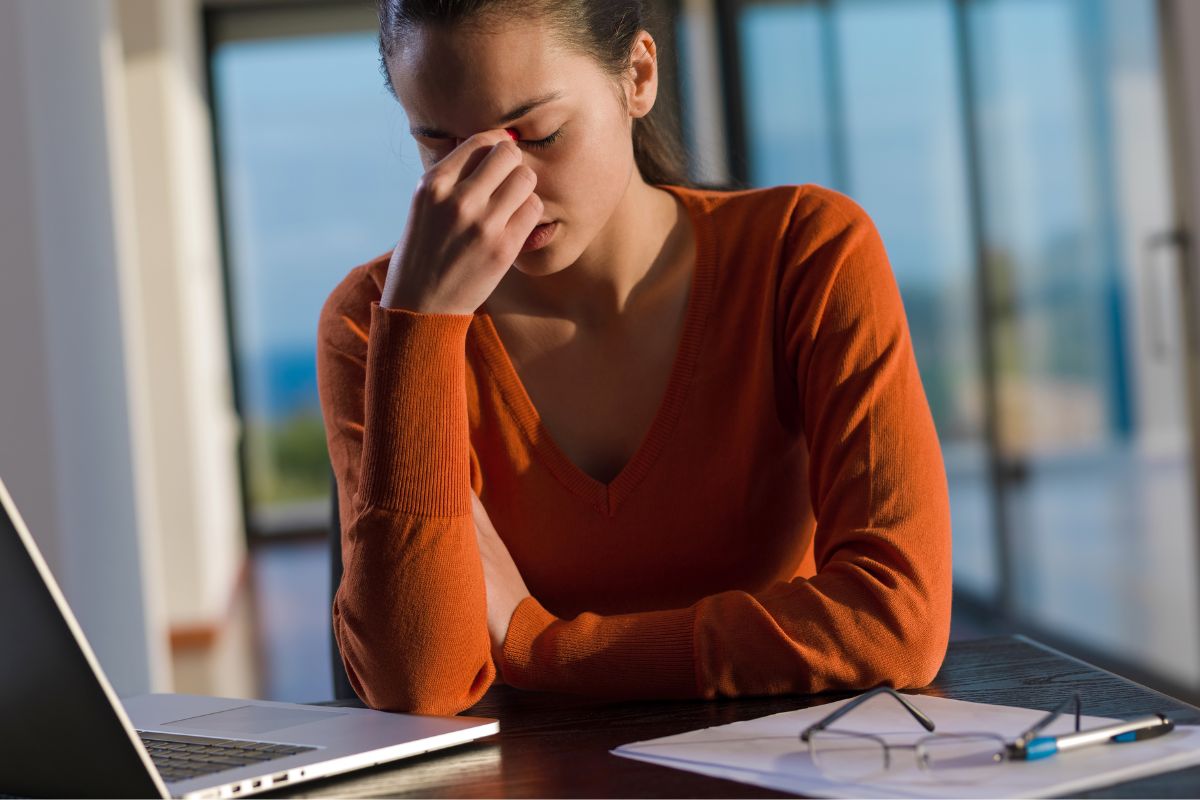 A picture of someone with a headache. 